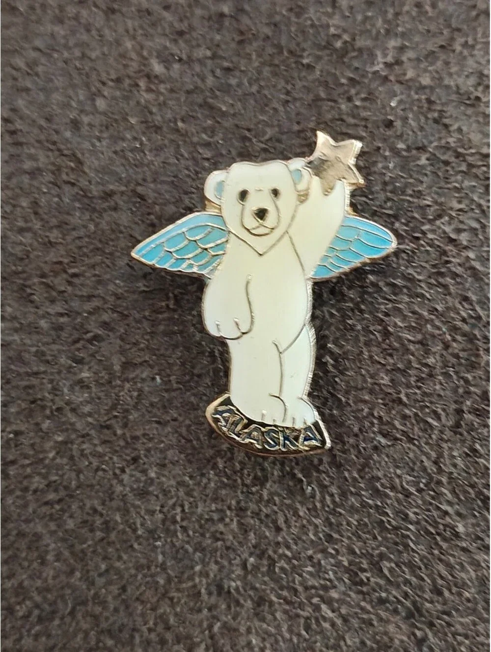1980s Alaskan Polar Bear Guardian Angel Gold Tone Enamel Pin.